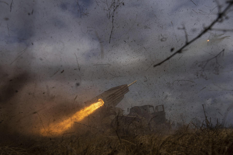 A Ukrainian MSLR BM-21 "Grad" of 95 Air Assault brigade fires towards Russian positions at the frontline near Kreminna, Ukraine, Thursday, March 9, 2023. (AP Photo/Evgeniy Maloletka)