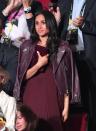 <p>Meghan made her own statement with a monochrome outfit, which she wore to the Invictus Games in Toronto right before she and Harry got engaged in 2017. She made sure that her jacket, dress, and clutch were all roughly the same shade of burgundy, which takes serious commitment!</p>