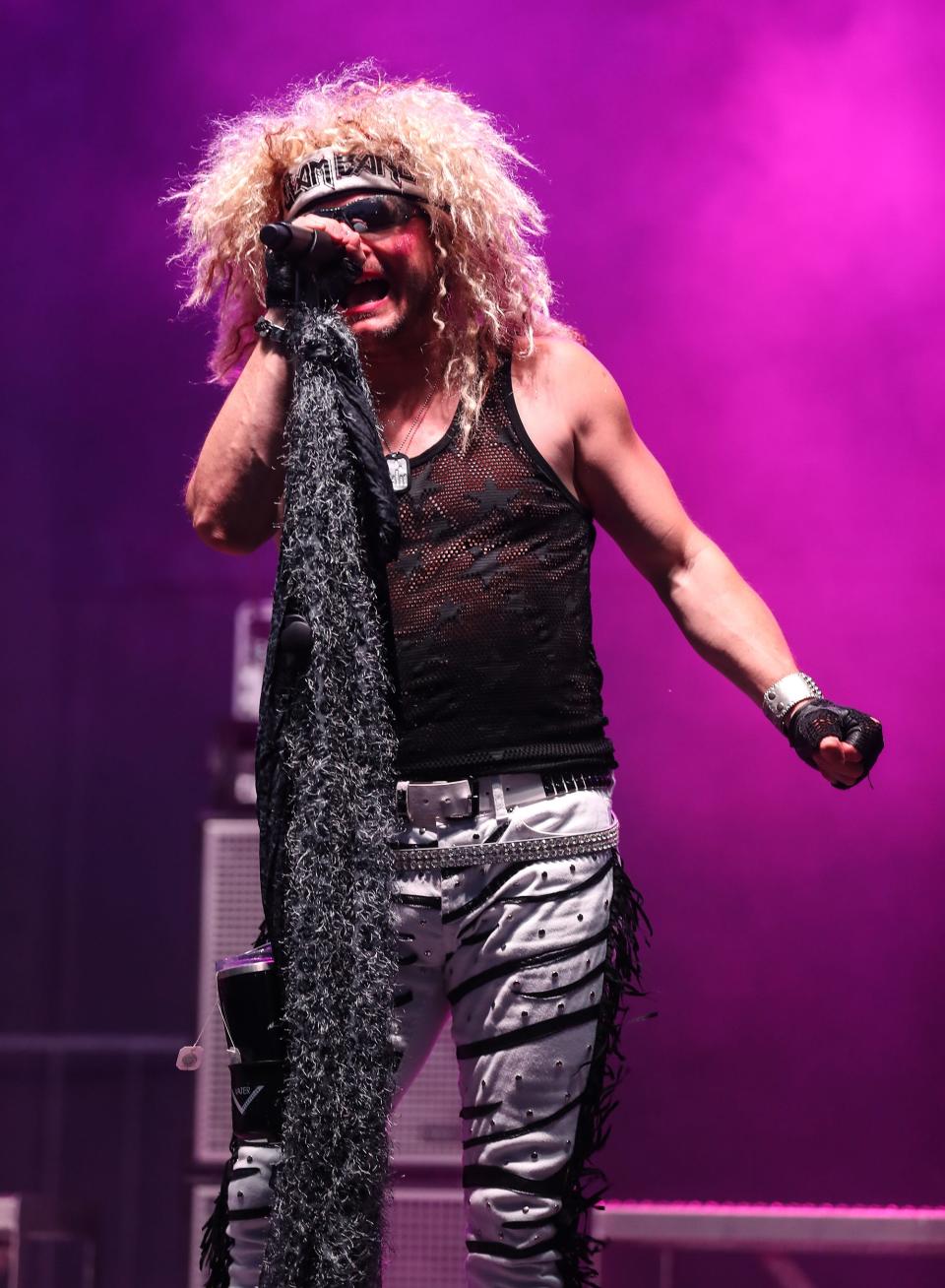 FILE - The 80s rock band Glam Band play on one of the stages Saturday, June 12, 2021, during Walleye Weekend at Lakeside Park in Fond du Lac