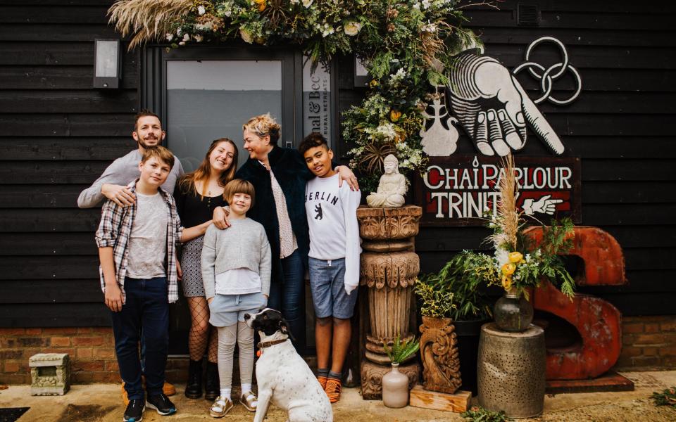 Vicky and Chris, their four children, and Hendrix the dog - Binky Nixon