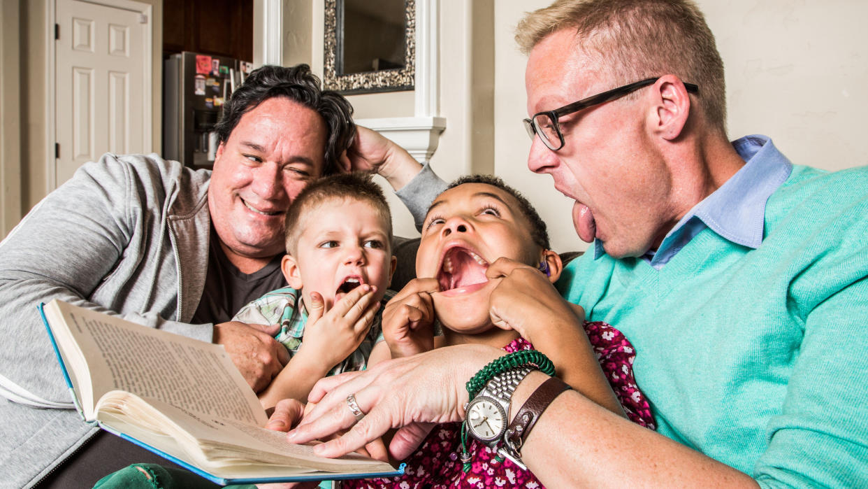  Family on the couch making faces. 