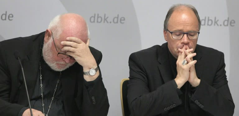 Cardinal Reinhard Marx (L) said he was ashamed over the decades of abuse carried out by Catholic Church officials in Germany