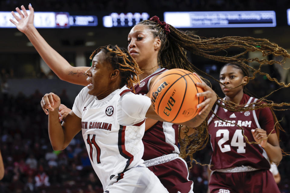 South Carolina guard Talaysia Cooper, left, drives past Texas A&M forward Aaliyah Patty during the first half of an NCAA college basketball game in Columbia, S.C., Thursday, Dec. 29, 2022. (AP Photo/Nell Redmond)