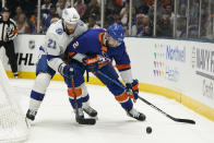 New York Islanders defenseman Nick Leddy (2) keeps control of the puck against Tampa Bay Lightning center Brayden Point (21) during the first period of Game 3 of the NHL hockey Stanley Cup semifinals, Thursday, June 17, 2021, in Uniondale, N.Y. (AP Photo/Frank Franklin II)