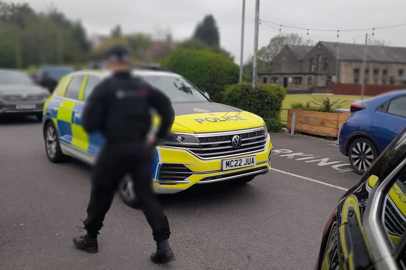 Police swarmed the streets in Wigan on Monday