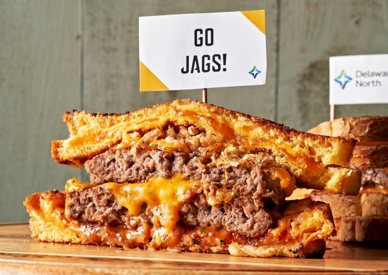 The grilled cheese cheeseburger — two quarter-pound patties sandwiched between two grilled cheese sandwiches and topped with crispy onions — will be offered to Jaguars fans by Tailgate Grill locations at TIAA Bank Field.