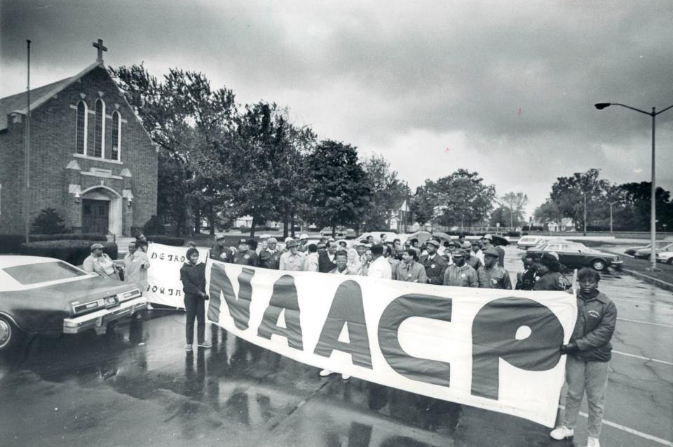 The Rev. Charles Adams led a march in Detroit that was part of NAACP-sponsored national day of mourning for victims of apartheid, South Africa's system of racial segregation.