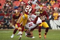 <p>Wide receiver Larry Fitzgerald #11 of the Arizona Cardinals is tackled by cornerback Josh Norman #24 of the Washington Redskins during the first quarter at FedExField on December 17, 2017 in Landover, Maryland. (Photo by Patrick Smith/Getty Images) </p>