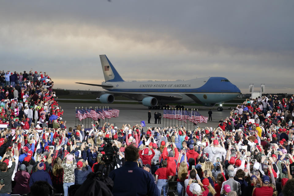 President Donald Trump arrives at a campaign rally at Des Moines International Airport, Wednesday, Oct. 14, 2020, in Des Moines, Iowa. (AP Photo/Charlie Neibergall)