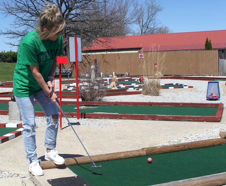 Whitney Harrison putts on one of the greens at Freedom Fairway on April 6, 2024.