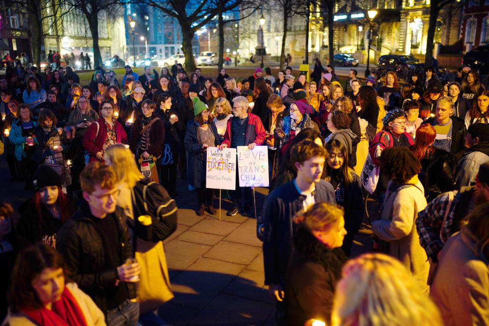 Members of the public attend a candle-lit vigil at College Green in Bristol city centre on Tuesday night in memory of transgender teenager Brianna Ghey. (PA)