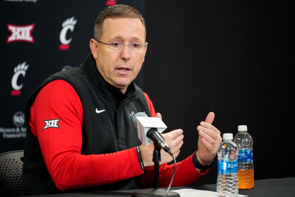 University of Cincinnati football head coach Scott Satterfield introduces his new defensive coordinator, Tyson Veidt, during a press conference at Fifth Third Arena in Cincinnati on Monday, Jan. 29, 2024. Veidt comes to UC from Iowa State.