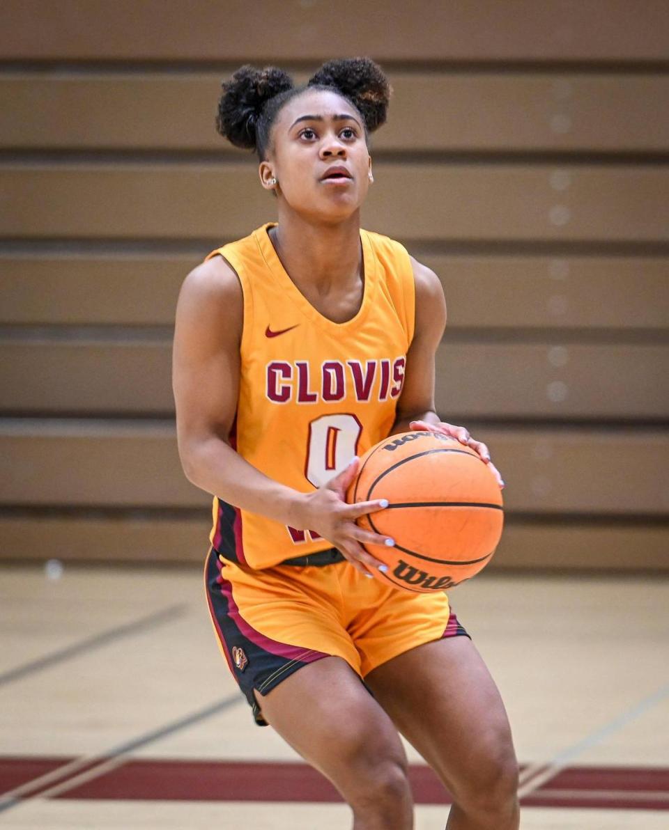 Clovis West girls basketball player Athena Tomlinson, The Fresno Bee’s high school girls basketball Player of the Year, takes a few warm-up shots on Monday, March 27, 2023. CRAIG KOHLRUSS/ckohlruss@fresnobee.com