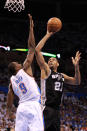 OKLAHOMA CITY, OK - JUNE 02: Tim Duncan #21 of the San Antonio Spurs shoots over Serge Ibaka #9 of the Oklahoma City Thunder in the first half in Game Four of the Western Conference Finals of the 2012 NBA Playoffs at Chesapeake Energy Arena on June 2, 2012 in Oklahoma City, Oklahoma. NOTE TO USER: User expressly acknowledges and agrees that, by downloading and or using this photograph, User is consenting to the terms and conditions of the Getty Images License Agreement. (Photo by Ronald Martinez/Getty Images)