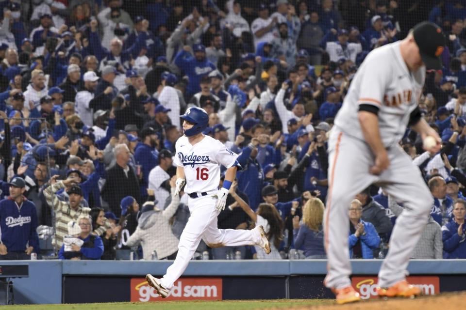 Dodgers' Will Smith rounds the bases after hitting a two-run home run off of Giants relief pitcher Jake McGee