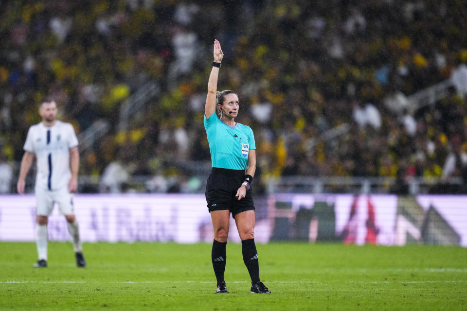 Referee Tori Penso, from the U.S., gestures during the Soccer Club World Cup first round soccer match between Al Ittihad and Auckland City FC at King Abdullah Sports City stadium in Jeddah, Saudi Arabia, Tuesday, Dec. 12, 2023. (AP Photo/Manu Fernandez)