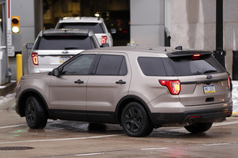 A motorcade of official vehicles arrives at federal court where Robert Bowers is to be arraigned on additional charges, Monday, Feb. 11, 2019, in Pittsburgh. Bowers is accused of killing 11 and wounding seven during an attack on a Pittsburgh synagogue in October of 2018. (AP Photo/Keith Srakocic)