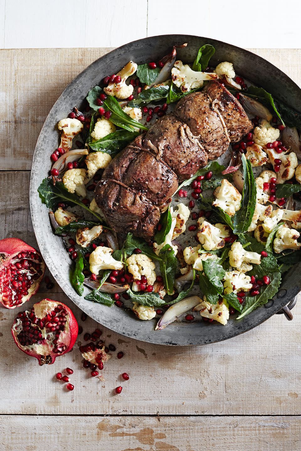 <p>This juicy beef tenderloin is brightened by a tangy cauliflower-pomegranate salad that is sure to satisfy any crowd.</p><p><strong><a href="https://www.countryliving.com/food-drinks/recipes/a6207/beef-tenderloin-roasted-cauliflower-pomegranate-salad-recipe-clx1214/" rel="nofollow noopener" target="_blank" data-ylk="slk:Get the recipe;elm:context_link;itc:0;sec:content-canvas" class="link ">Get the recipe</a>.</strong> </p>