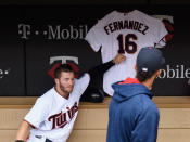 <p>Robbie Grossman #36 of the Minnesota Twins touches a jersey hung in the dugout in remembrance of Jose Fernandez #16 of the Miami Marlins as teammate Eddie Rosario #20 looks on before the game against the Seattle Mariners on September 25, 2016 at Target Field in Minneapolis, Minn. (Hannah Foslien/Getty Images) </p>