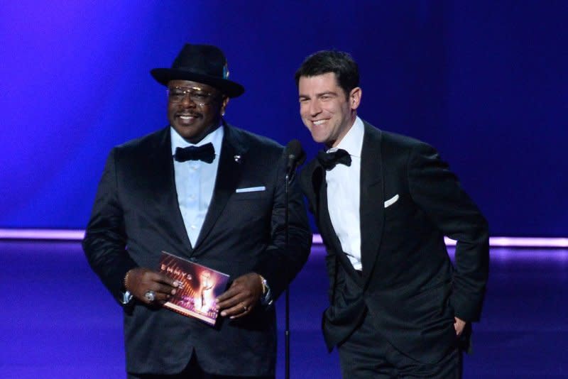 Cedric the Entertainer (L) and Max Greenfield attend the Primetime Emmy Awards in 2019. File Photo by Jim Ruymen/UPI