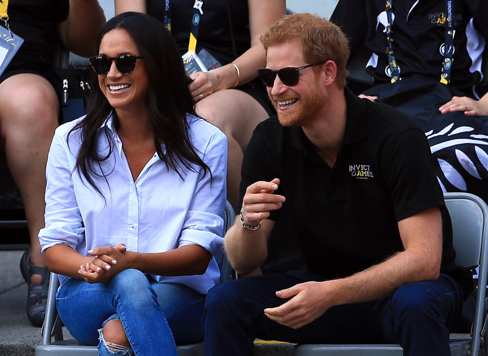 TORONTO, ON - SEPTEMBER 25:  Prince Harry (R) and Meghan Markle (L) attend a Wheelchair Tennis match during the Invictus Games 2017 at Nathan Philips Square on September 25, 2017 in Toronto, Canada.  (Photo by Vaughn Ridley/Getty Images for the Invictus Games Foundation)