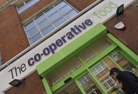 A customer enters a branch of a Co-operative food store in central London April 16, 2014. REUTERS/Toby Melville