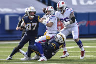 Buffalo Bills quarterback Josh Allen (17) is sacked by Los Angeles Chargers defensive end Isaac Rochell (98) during the first half of an NFL football game, Sunday, Nov. 29, 2020, in Orchard Park, N.Y. (AP Photo/Adrian Kraus)