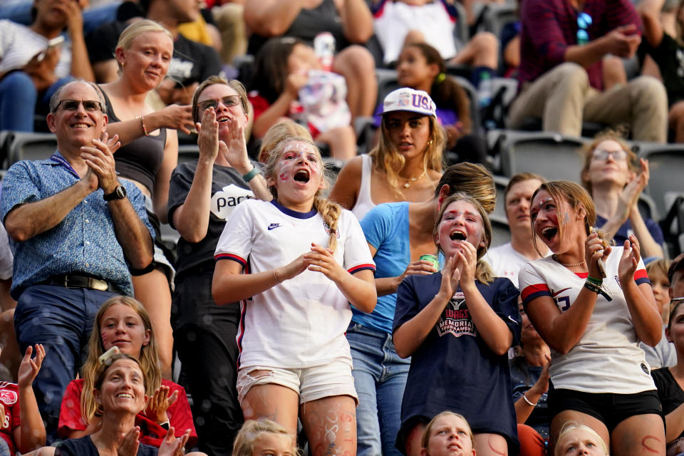 Spectators react as the United States records a goal on an own goal by Nigeria during the first half of an international friendly soccer match, Tuesday, Sept. 6, 2022, in Washington. (AP Photo/Julio Cortez)