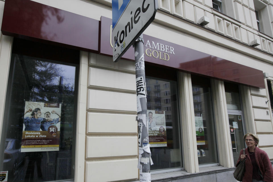 A closed outlet of the financial institute Amber Gold in Warsaw, Poland, Monday, Aug. 27, 2012, after the organization was liquidated and has emerged as an unsustainable pyramid scheme. Amber Gold promised guaranteed returns of between 10 to 14 percent annually for what it claimed were investments in gold and for many of its clients who grew up under communism the prospects of high returns on investments was too much to resist. Now officials say it operated like a pyramid scheme, and thousands of its clients are facing the prospect of never seeing their money again.(AP Photo/Czarek Sokolowski)