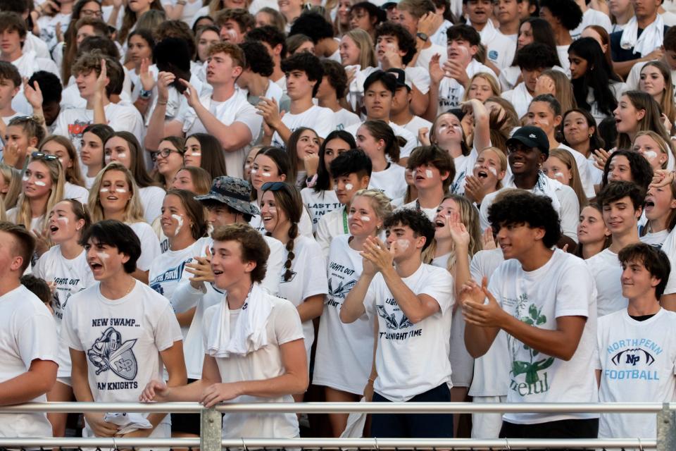 The North Penn student section cheers from the stands during a football game against La Salle at North Penn High School in Lansdale on Friday, August 26, 2022. The Explorers defeated the Knights 37-28.