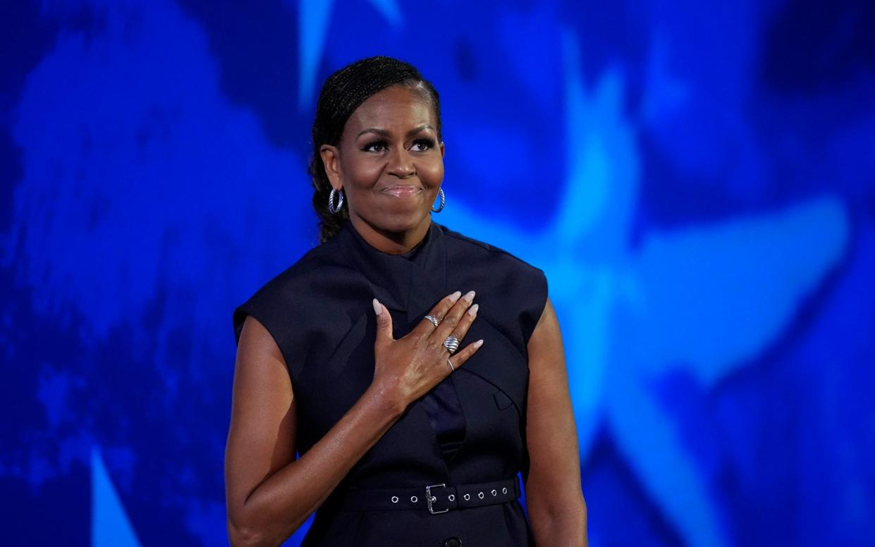 Former first lady Michelle Obama takes the stage during Day 2 of the Democratic National Convention