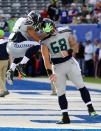 <p>Thomas Rawls #34 of the Seattle Seahawks reacts with teammate Justin Britt #68 during warm-ups before taking on the New York Giants at MetLife Stadium on October 22, 2017 in East Rutherford, New Jersey. (Photo by Abbie Parr/Getty Images) </p>