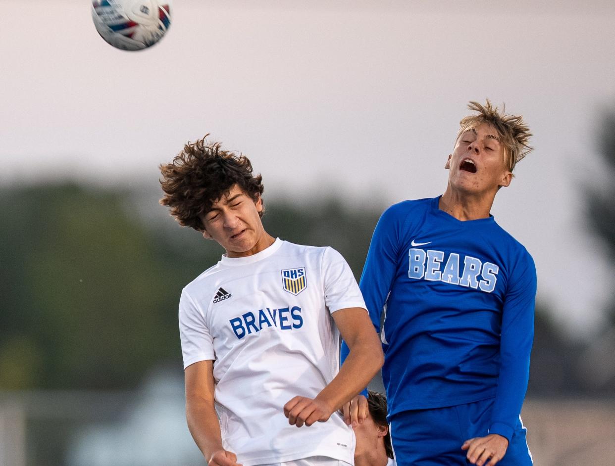 Olentangy's Christos Zenios, left, and Olentangy Berlin's Kyler Foreman go up for a header during a 3-all tie Sept. 14 at Berlin.