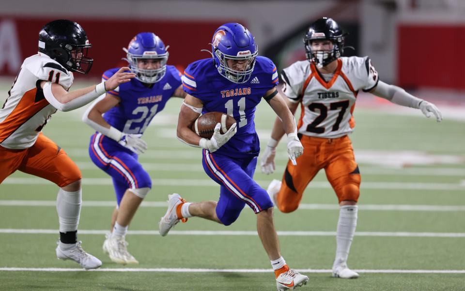 Parkston's Luke Bormann heads to the end zone for one his two touchdowns during the state Class 9AA football championship on Thursday, Nov. 9, 2023 in Vermillion's DakotaDome. Parkston won 12-7. Others pictured are Parkston's Kaden Holzbauer (21) and Howard's Taiden Hoyer (11) and Tate Miller (27).