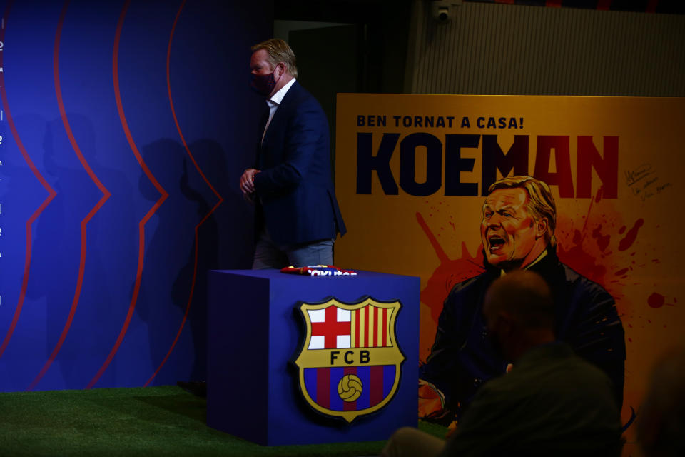 Ronald Koeman arrives for his official presentation as coach for FC Barcelona in Barcelona, Spain, Wednesday, Aug. 19, 2020. Barcelona officially announced earlier on Wednesday a deal with Koeman to become their coach five days after the team's humiliating 8-2 loss to Bayern Munich in the Champions League quarterfinals. Barcelona says the former defender's deal runs through June 2022. Koeman replaces the fired Quique Setien. (AP Photo/Joan Monfort)