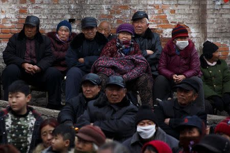 Locals and retired workers watch a Chinese opera performance that Xinyuan Steel put on to mark the end of Chinese New Year festivities in Anyang, Henan province, China, February 19, 2019. REUTERS/Thomas Peter