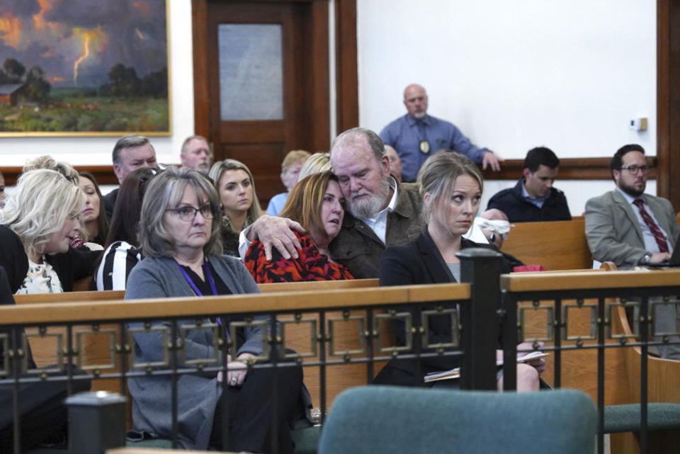 Larry and Kay Woodcock, center, grandparents of Joshua "JJ" Vallow, listen during a court hearing for Lori Vallow Daybell in St. Anthony, Idaho on April 19, 2022. A mother charged with murder in the deaths of her two children is set to stand trial in Idaho. The proceedings against Lori Vallow Daybell beginning Monday, April 3, 2023, could reveal new details in the strange, doomsday-focused case. (Tony Blakeslee/EastIdahoNews.com via AP, Pool)