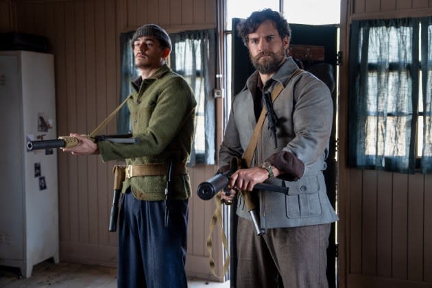 Hero Fiennes Tiffin (left) and Henry Cavill in 'The Ministry of Ungentlemanly Warfare' - Credit: Daniel Smith/Lionsgate