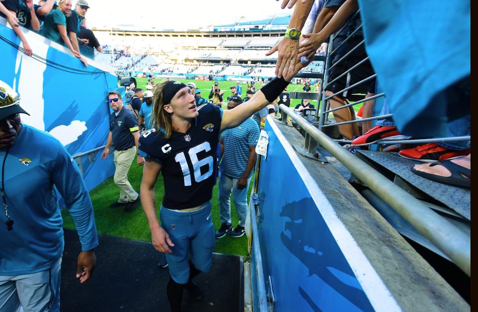 Jacksonville Jaguars quarterback Trevor Lawrence (16) greets fans as he leaves the field after Sunday's victory over the Ravens. The Jacksonville Jaguars hosted the Baltimore Ravens at TIAA Bank Field in Jacksonville, FL Sunday, November 27, 2022. The Jaguars got momentum late in the game to win 28 to 27 over the Ravens. [Bob Self/Florida Times-Union]