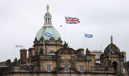 British and Scottish flags fly outside the Lloyds Banking Group's Scottish headquarters in Edinburgh, Scotland May 1, 2014. REUTERS/Suzanne Plunkett