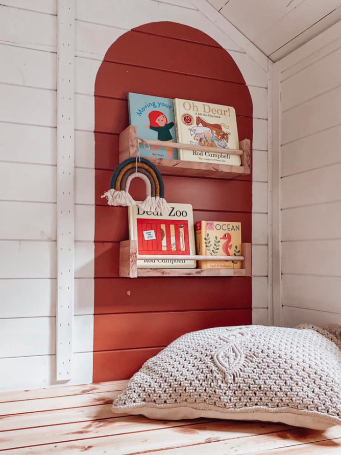 Cushion and bookcase in kid's playhouse