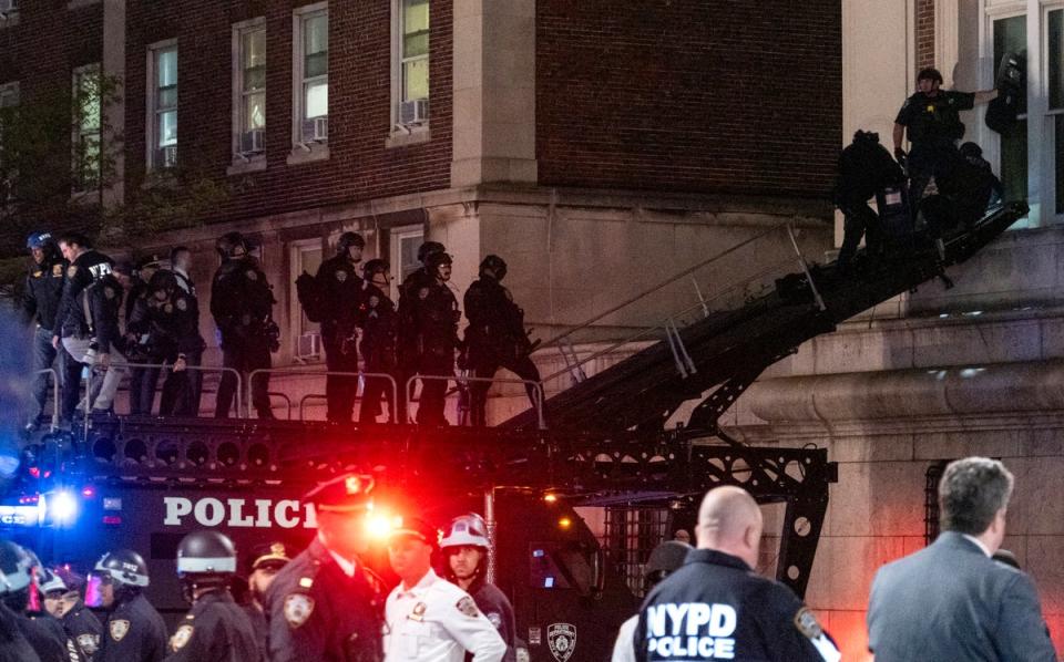 Police used a SWAT ramp to enter the upper floors of Hamilton Hall on Tuesday (AP)
