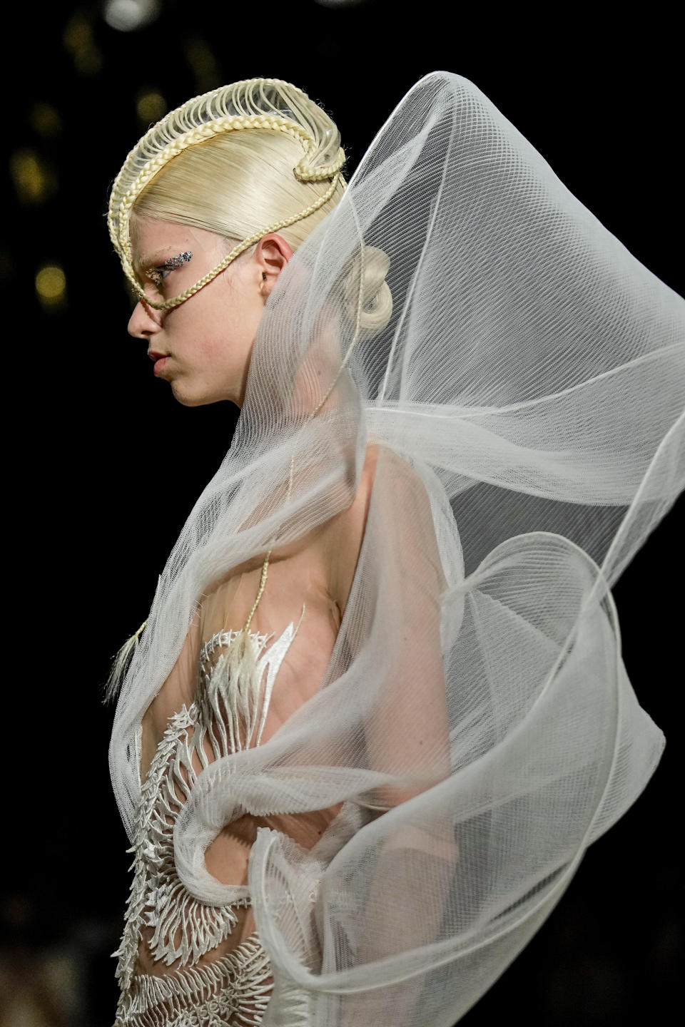 A model wears a creation as part of Iris van Herpen Haute Couture Fall/Winter 2022-2023 fashion collection presented Monday, July 4, 2022 in Paris. (AP Photo/Michel Euler)