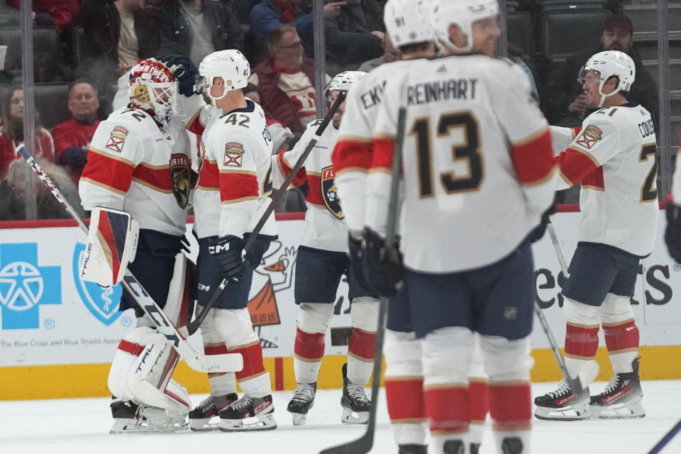 Florida Panthers players celebrate after defeating the Detroit Red Wings in an NHL hockey game Thursday, Nov. 2, 2023, in Detroit. (AP Photo/Paul Sancya)