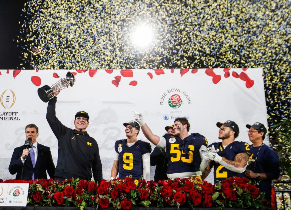 Coach Jim Harbaugh's Michigan Wolverines earned a spot in the national championship game with a 27-20 overtime victory over Alabama.