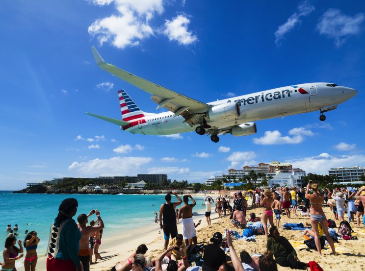 Planes are known for flying over the beaches of Sint Maarten (Picture: REX)