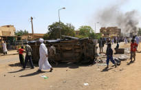 A police car flipped over and damaged by mourners is seen near the home of a demonstrator who died of a gunshot wound sustained during anti-government protests in Khartoum, Sudan January 18, 2019. REUTERS/Mohamed Nureldin Abdallah