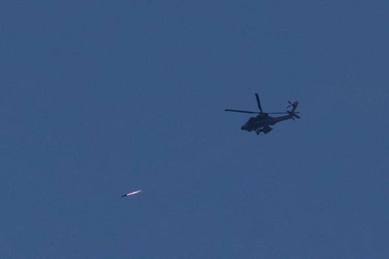 A Helicopter fires a rocket along the southern border of Israel and Gaza as fighting between Israeli troops and Islamist Hamas militants continues. Ilia Yefimovich/dpa