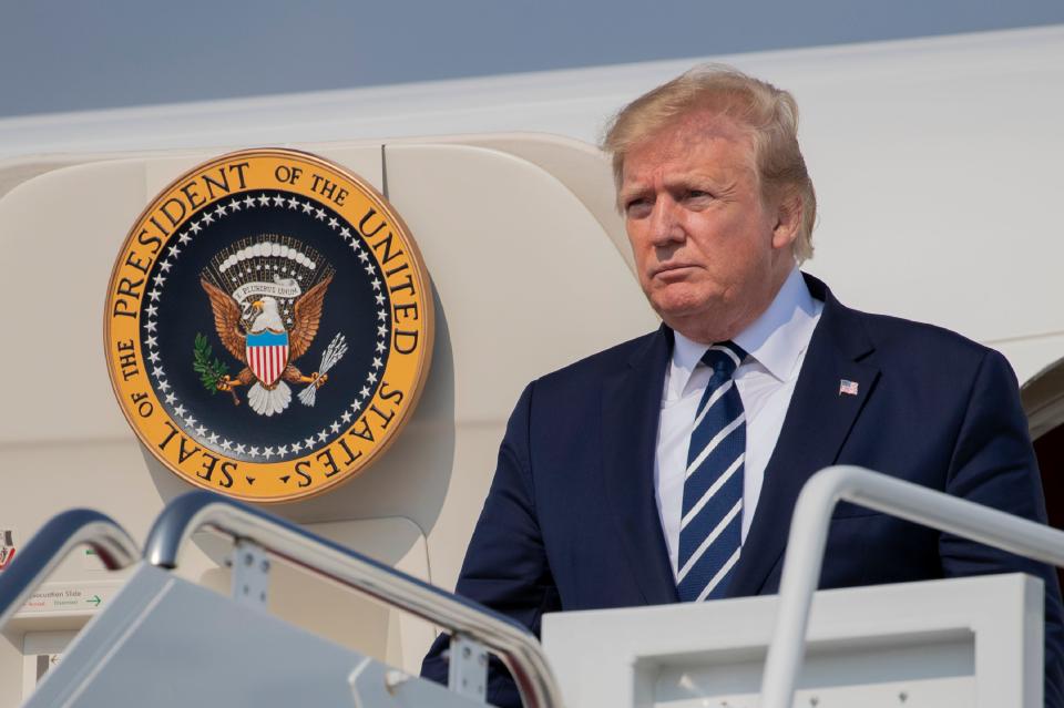 President Donald Trump disembarks Air Force One at Andrews Air Force Base, Md., on July 21, 2019.