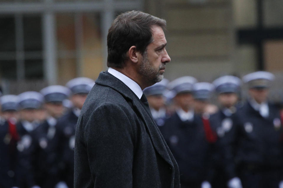 French Interior Minister Christophe Castaner walks in the courtyard of the Paris police headquarters during a ceremony for the four victims of last week's knife attack, Tuesday, Oct. 8, 2019 in Paris. France's presidency says the four victims of last week's knife attack at the Paris police headquarters will be posthumously given France's highest award, the Legion of Honor. (AP Photo/Francois Mori)